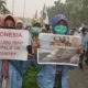 indonesian students holds posters as they protest against the palm oil industry in pekanbaru riau pr